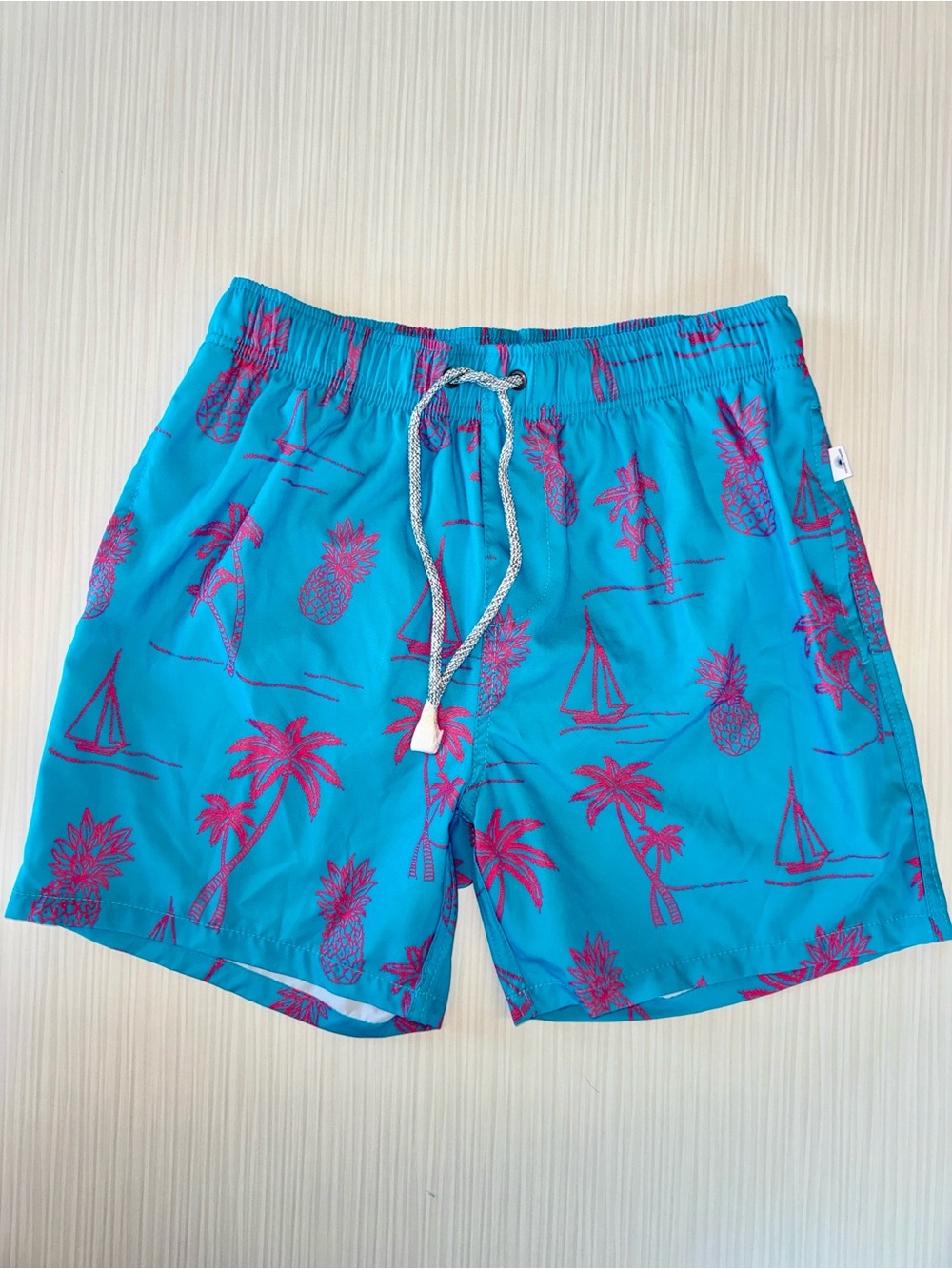 Turquoise Swim Trunks with Pink Tropical Print
